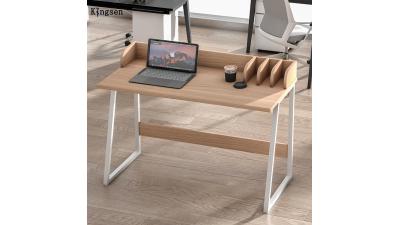 A desk with white metal legs